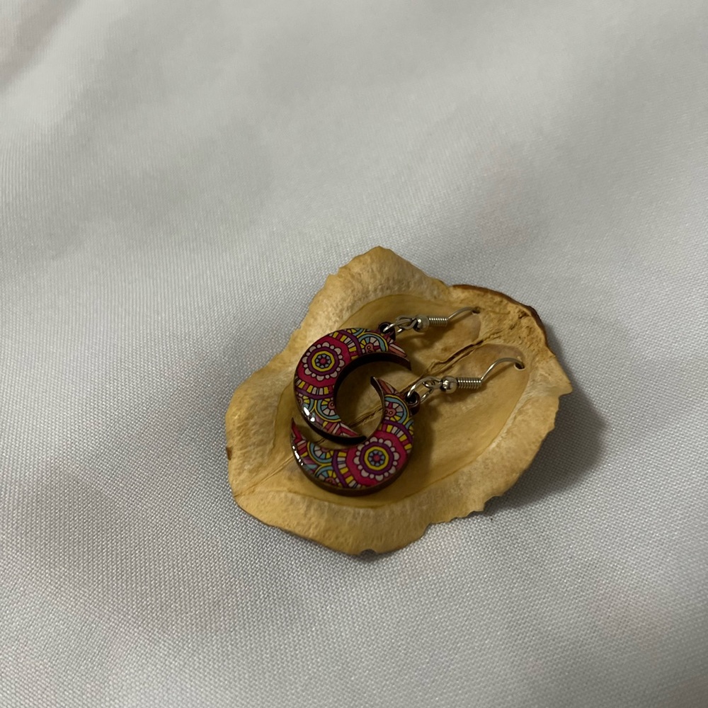 Earring are made in Mexico they are made from wood and are beautiful colors